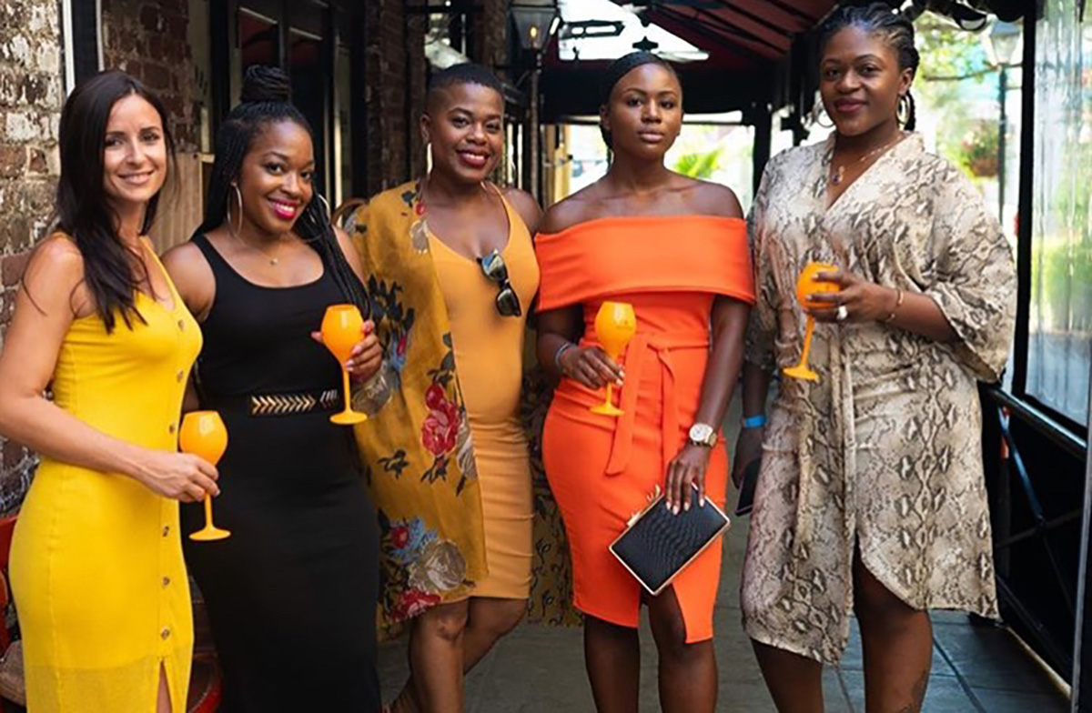 Image of five women holding glasses of Veuve Clicquot champagne. Photo credit to @jovisualstudios on Instagram